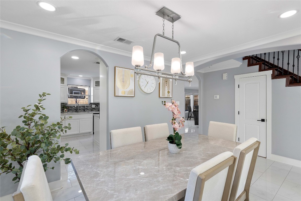 405 Mystic Trail Loop Houston, TX 77339 - Photo 8 of 44 a view of a dining room and chandelier