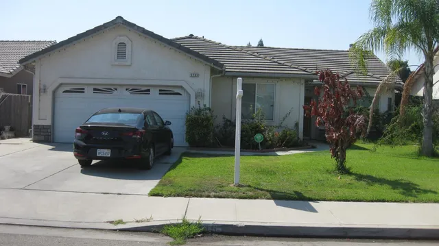 a house view with a garden space