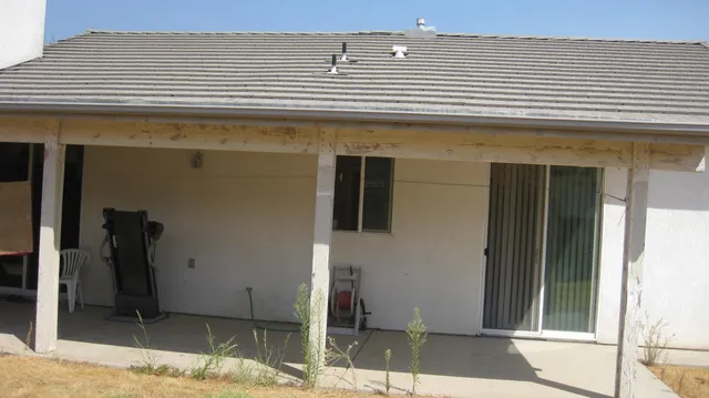 a view of a bathroom with a sink and chandelier fan