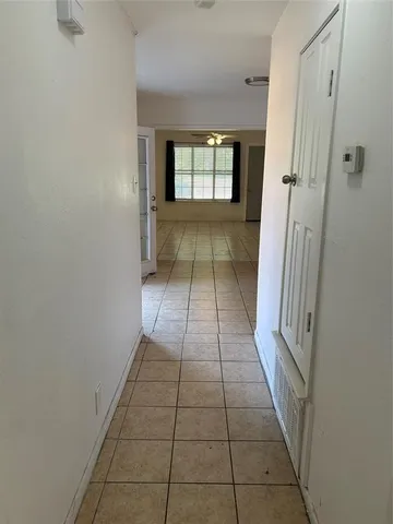 a view of an empty room and window