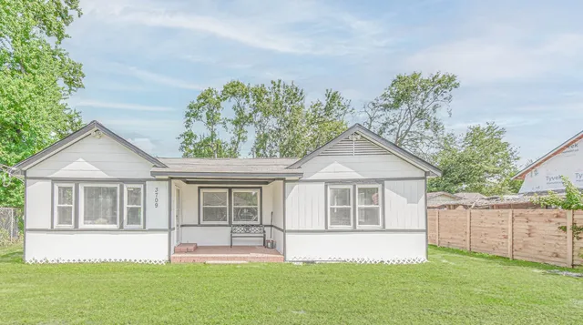 front view of a house with a yard