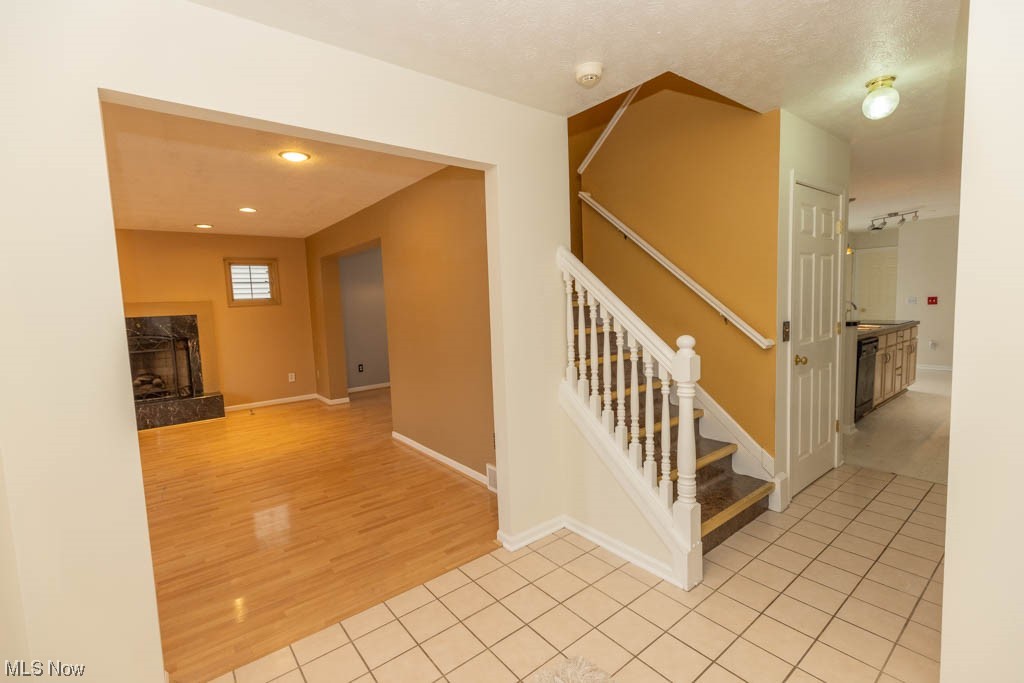 4376 Archer Road Cleveland, OH 44105 - Photo 2 of 30 Stairway featuring light tile flooring