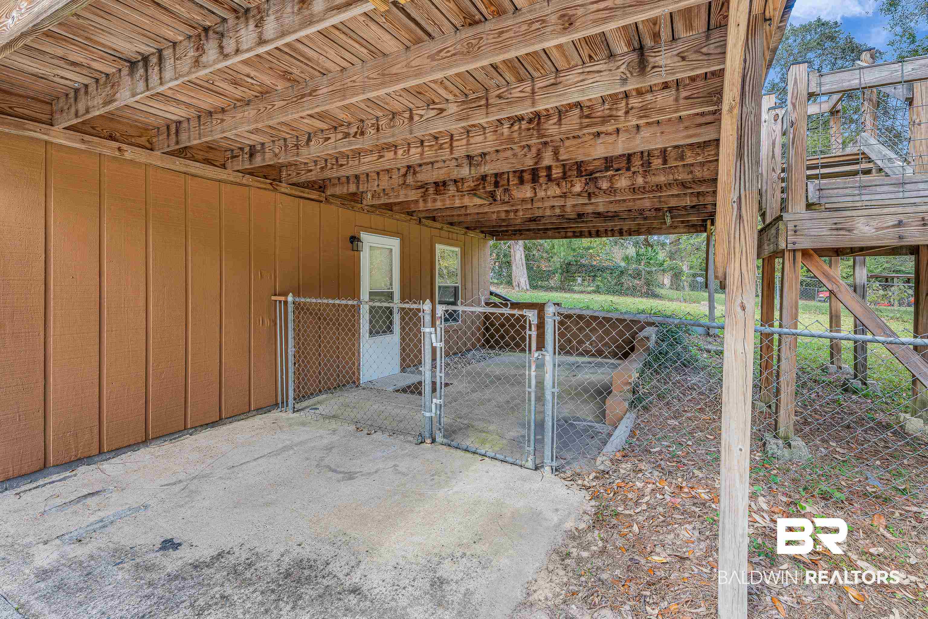 22970 River Road South Daphne, AL 36526 - Photo 6 of 48 View of patio featuring a gate