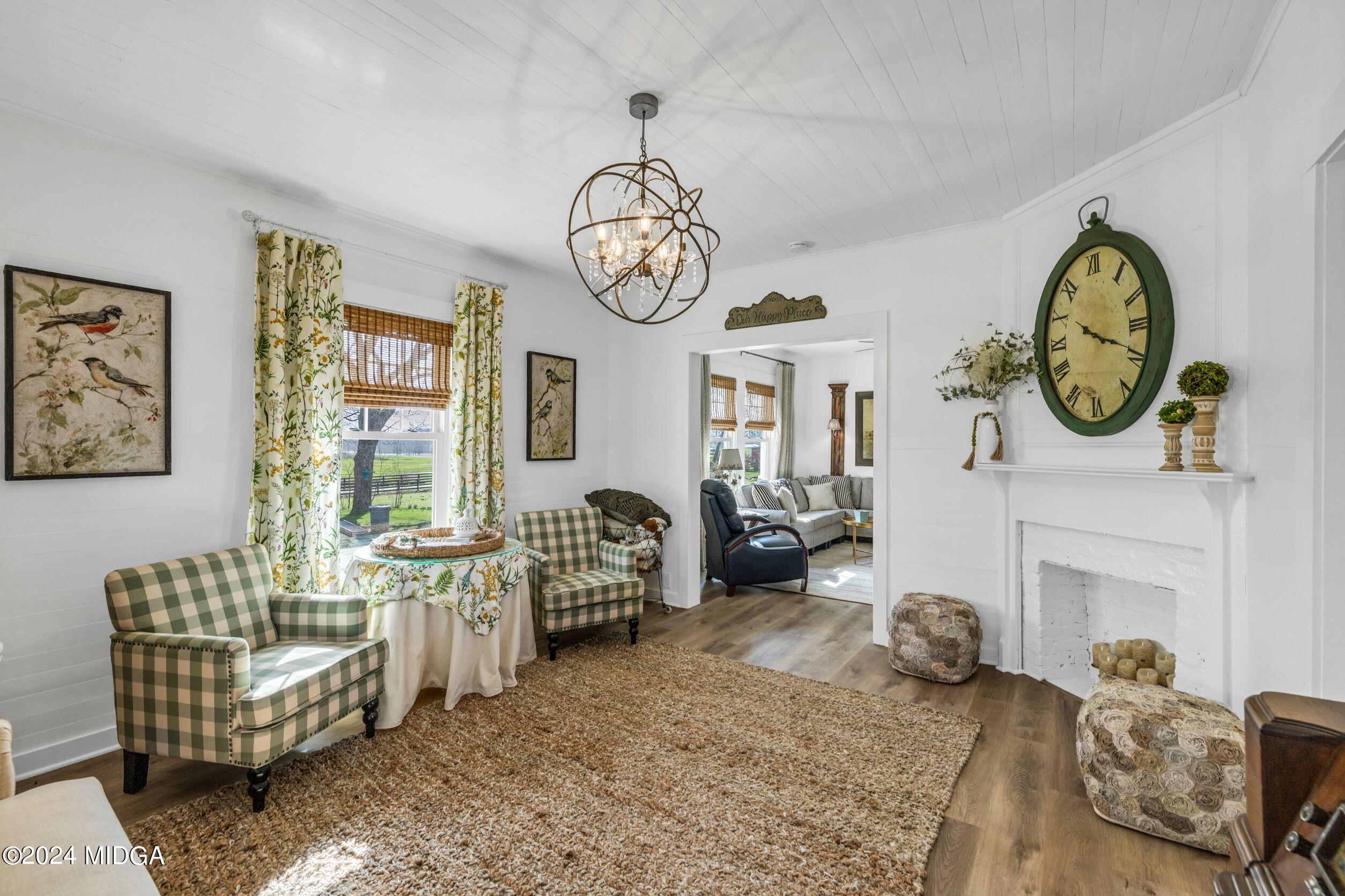 475 Brent Road Barnesville, GA 30204 - Photo 110 of 132 a living room with furniture a window and a clock