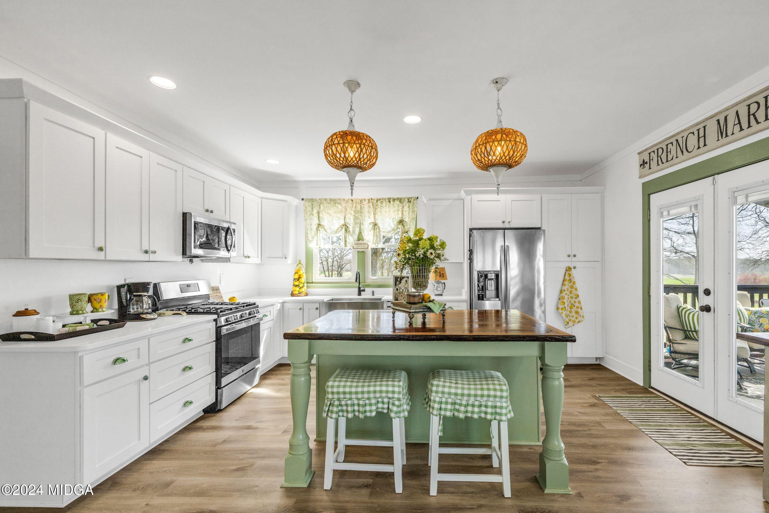 475 Brent Road Barnesville, GA 30204 - Photo 117 of 132 a kitchen with stainless steel appliances granite countertop a stove and cabinets