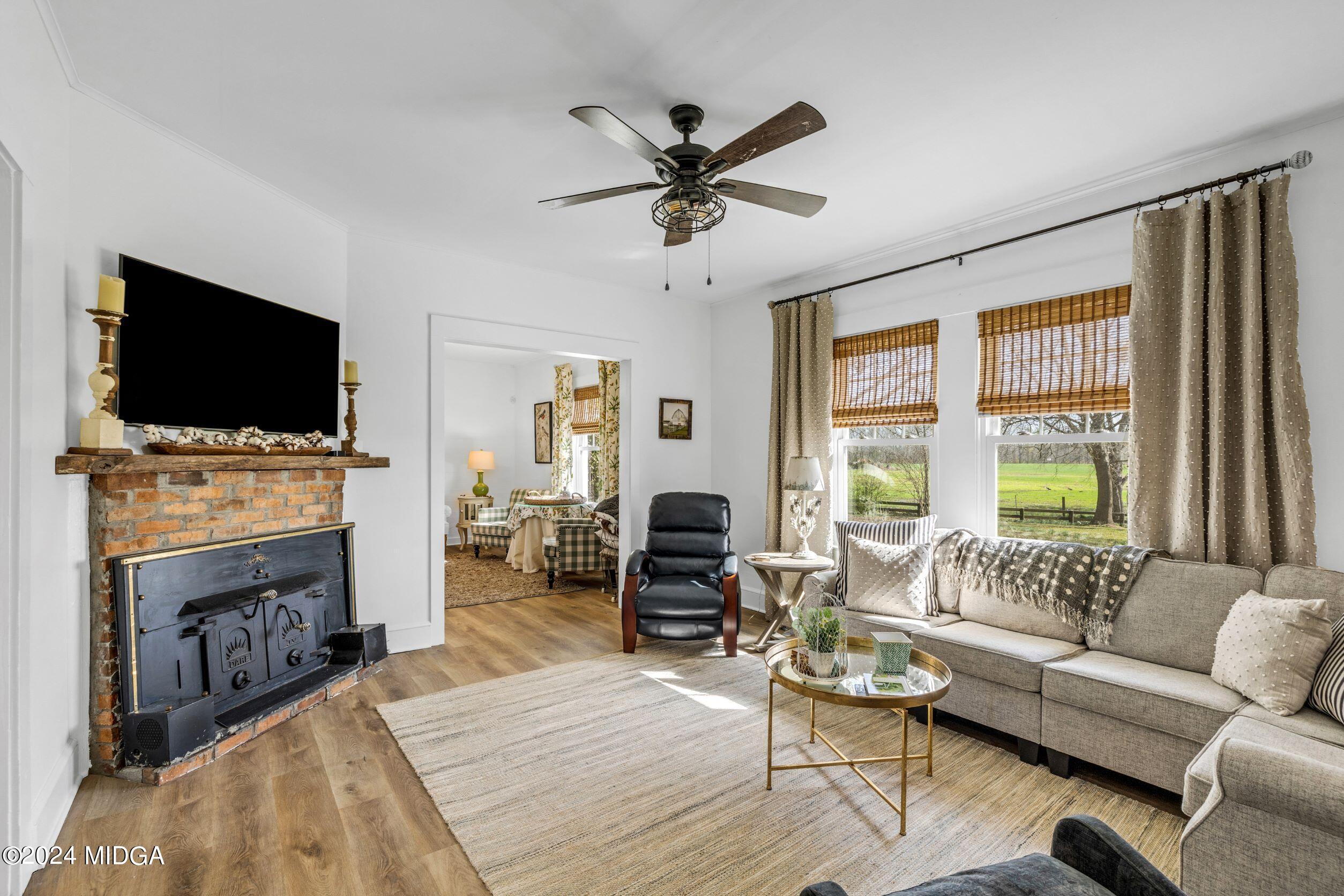 475 Brent Road Barnesville, GA 30204 - Photo 119 of 132 a living room with fireplace furniture and a flat screen tv