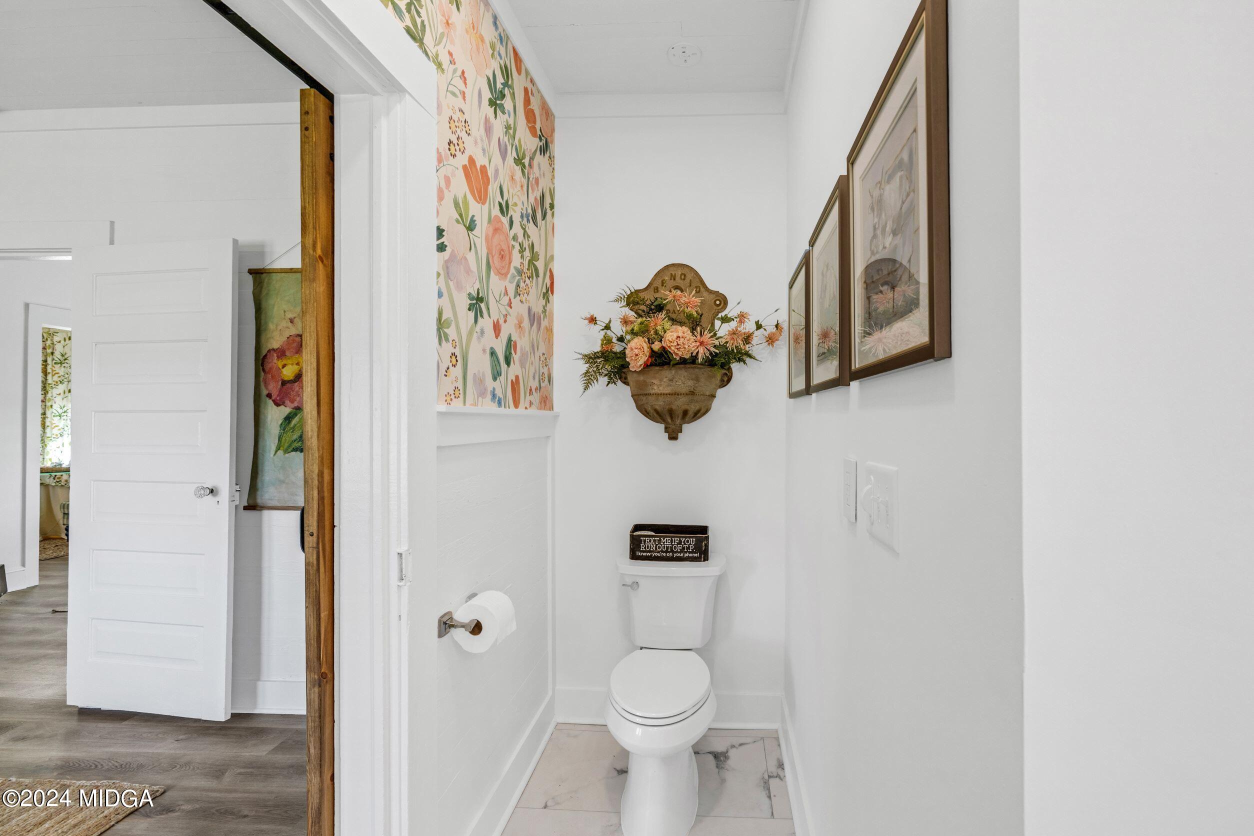 475 Brent Road Barnesville, GA 30204 - Photo 122 of 132 a white toilet sitting next to a bathroom sink
