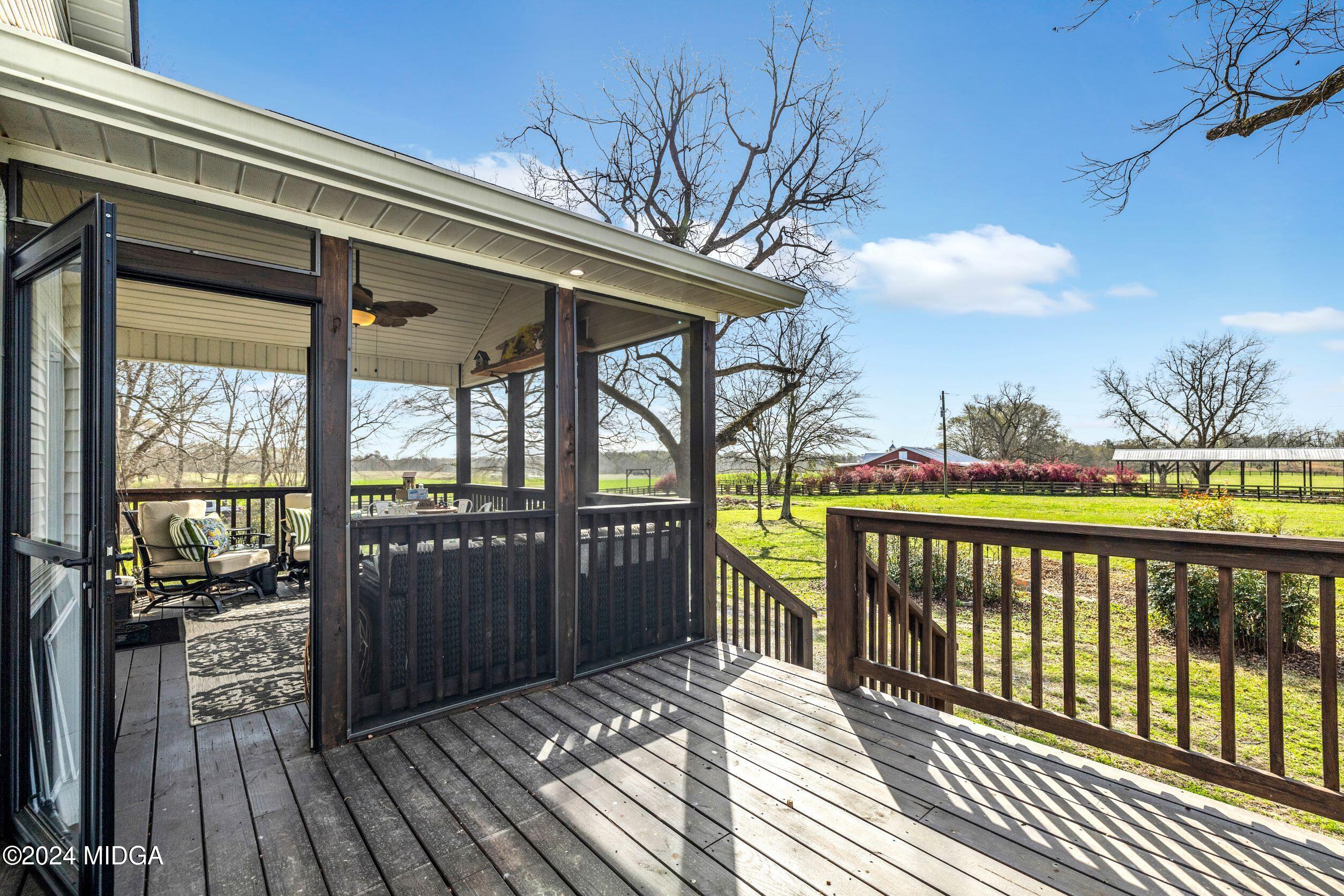 475 Brent Road Barnesville, GA 30204 - Photo 127 of 132 a view of a balcony with wooden floor and fence
