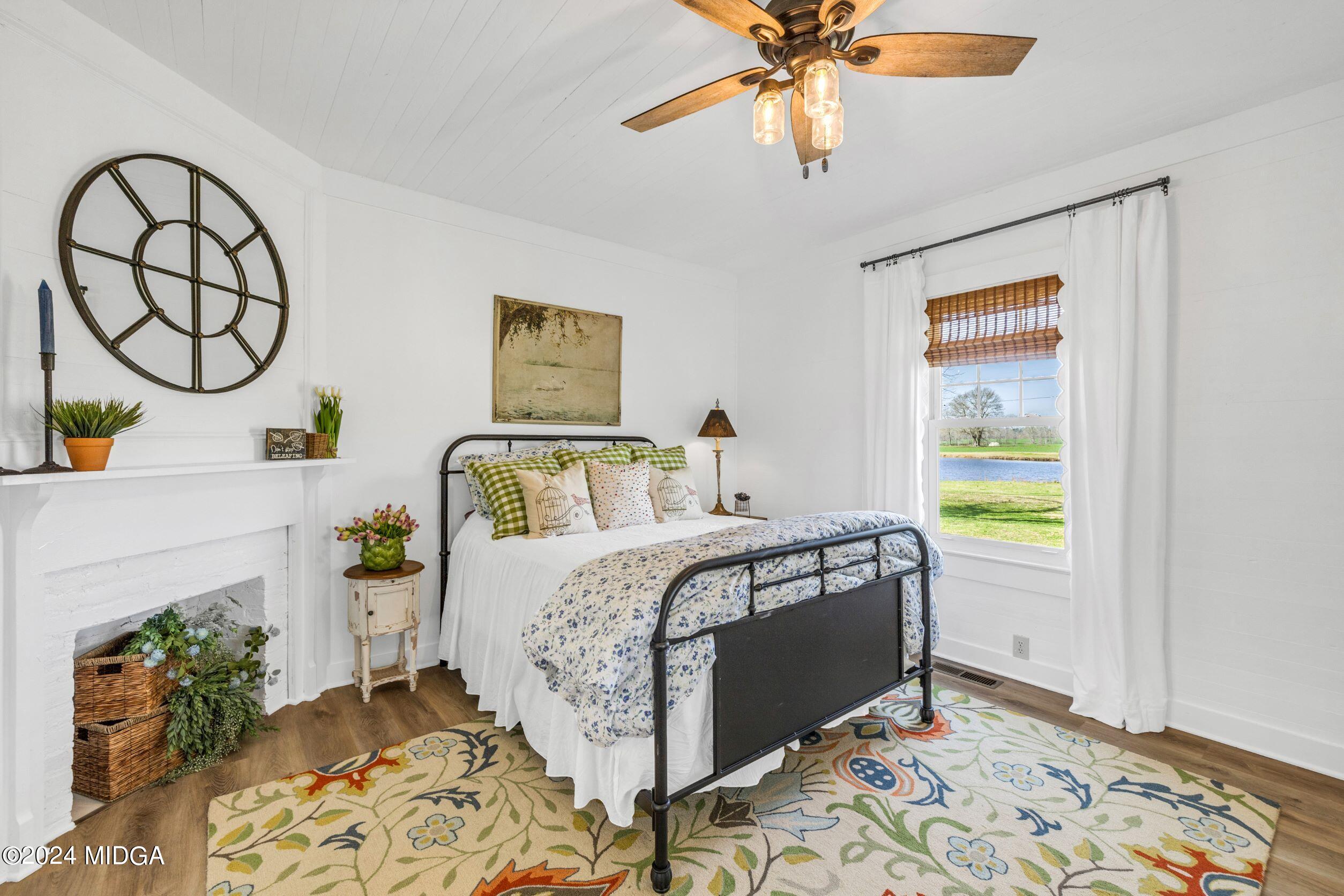 475 Brent Road Barnesville, GA 30204 - Photo 130 of 132 a bedroom with a bed and a window