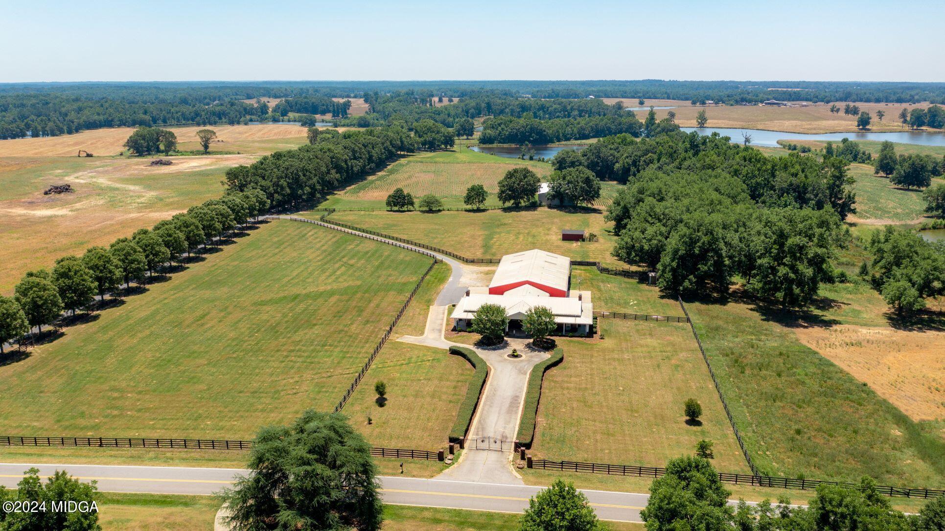 475 Brent Road Barnesville, GA 30204 - Photo 2 of 132 an aerial view of a house with a garden