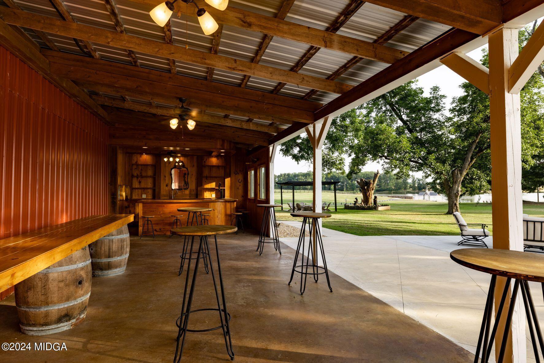 475 Brent Road Barnesville, GA 30204 - Photo 38 of 132 a view of a porch with furniture and a yard
