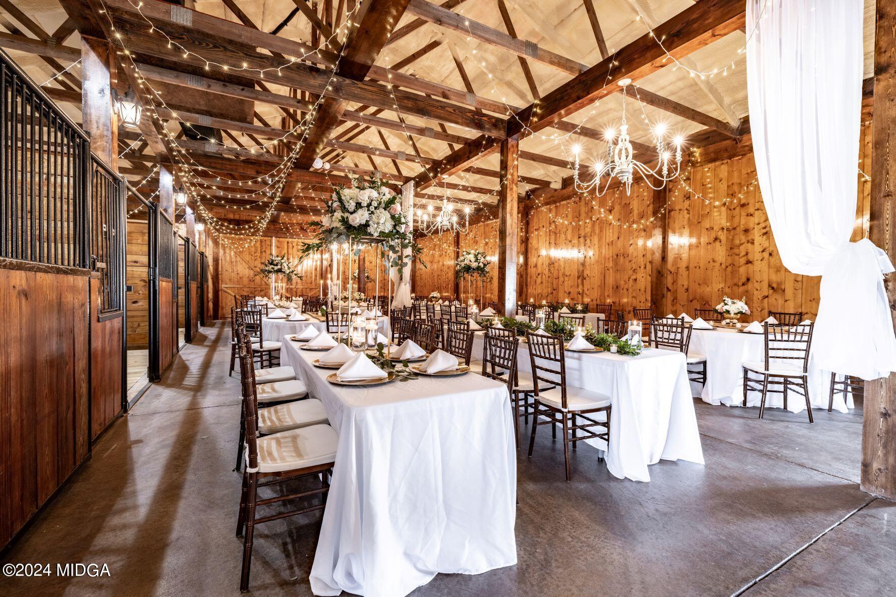 475 Brent Road Barnesville, GA 30204 - Photo 45 of 132 a view of a patio with couches and table and chairs with wooden fence and floor