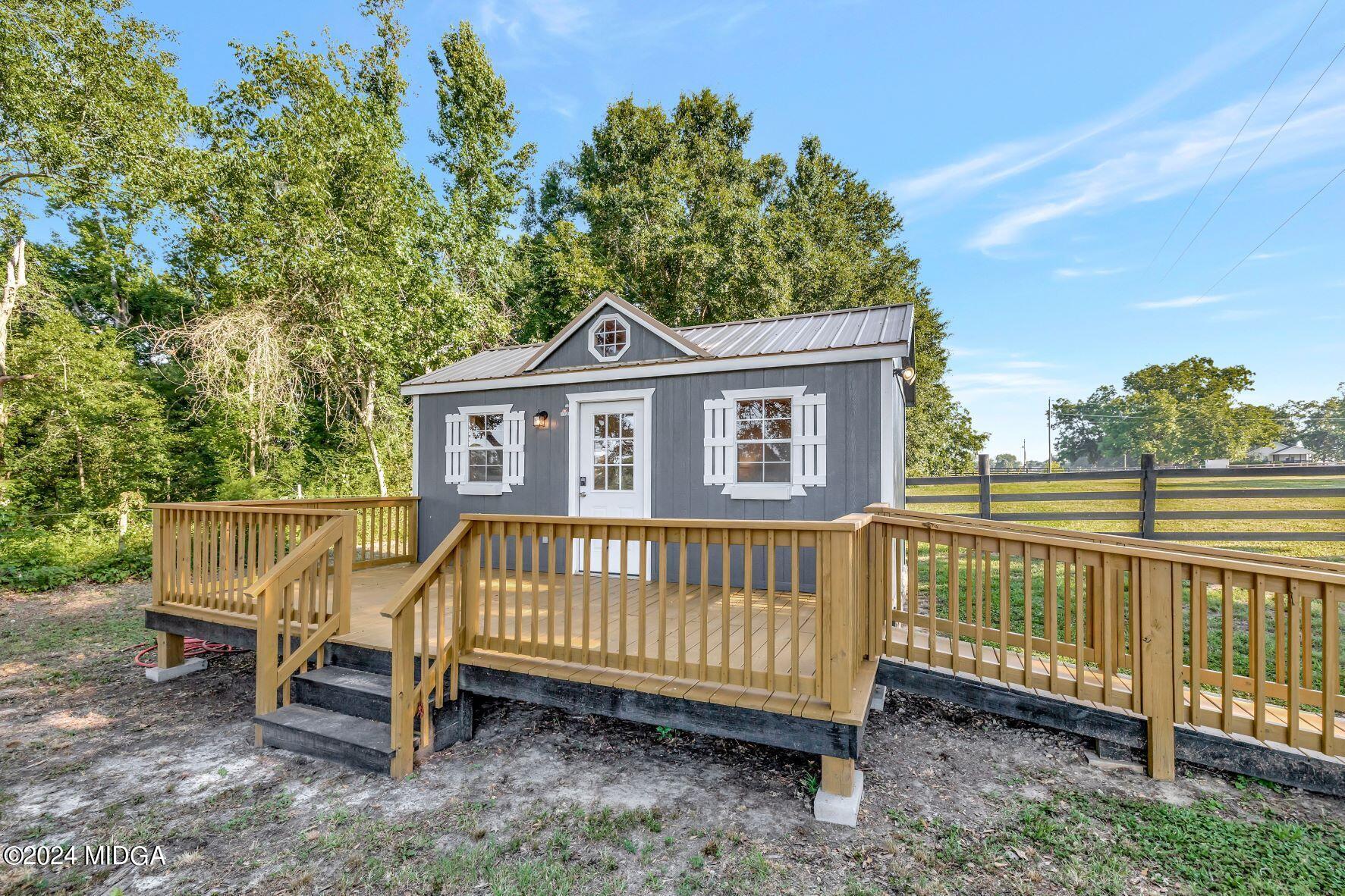 475 Brent Road Barnesville, GA 30204 - Photo 53 of 132 a view of a house with a yard and a wooden deck
