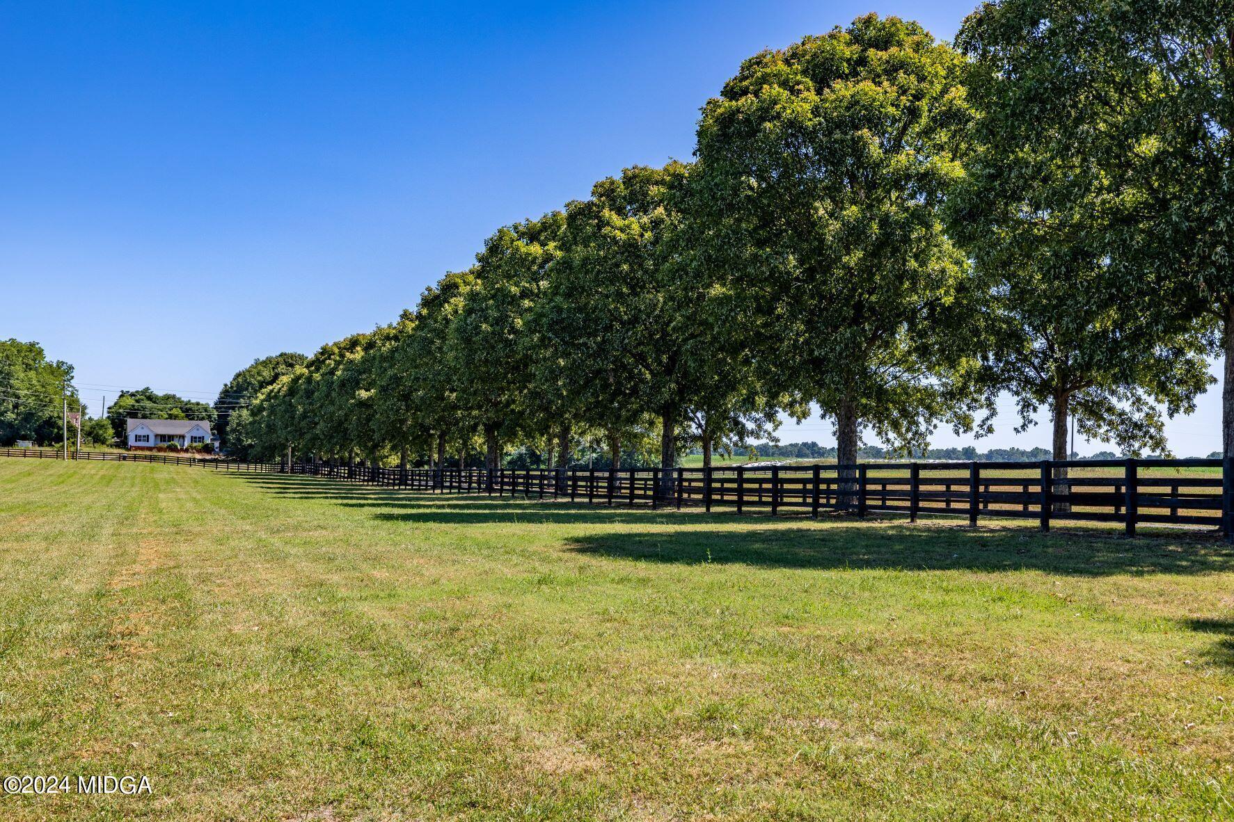 475 Brent Road Barnesville, GA 30204 - Photo 6 of 132 a view of a swimming pool with an outdoor space and seating area