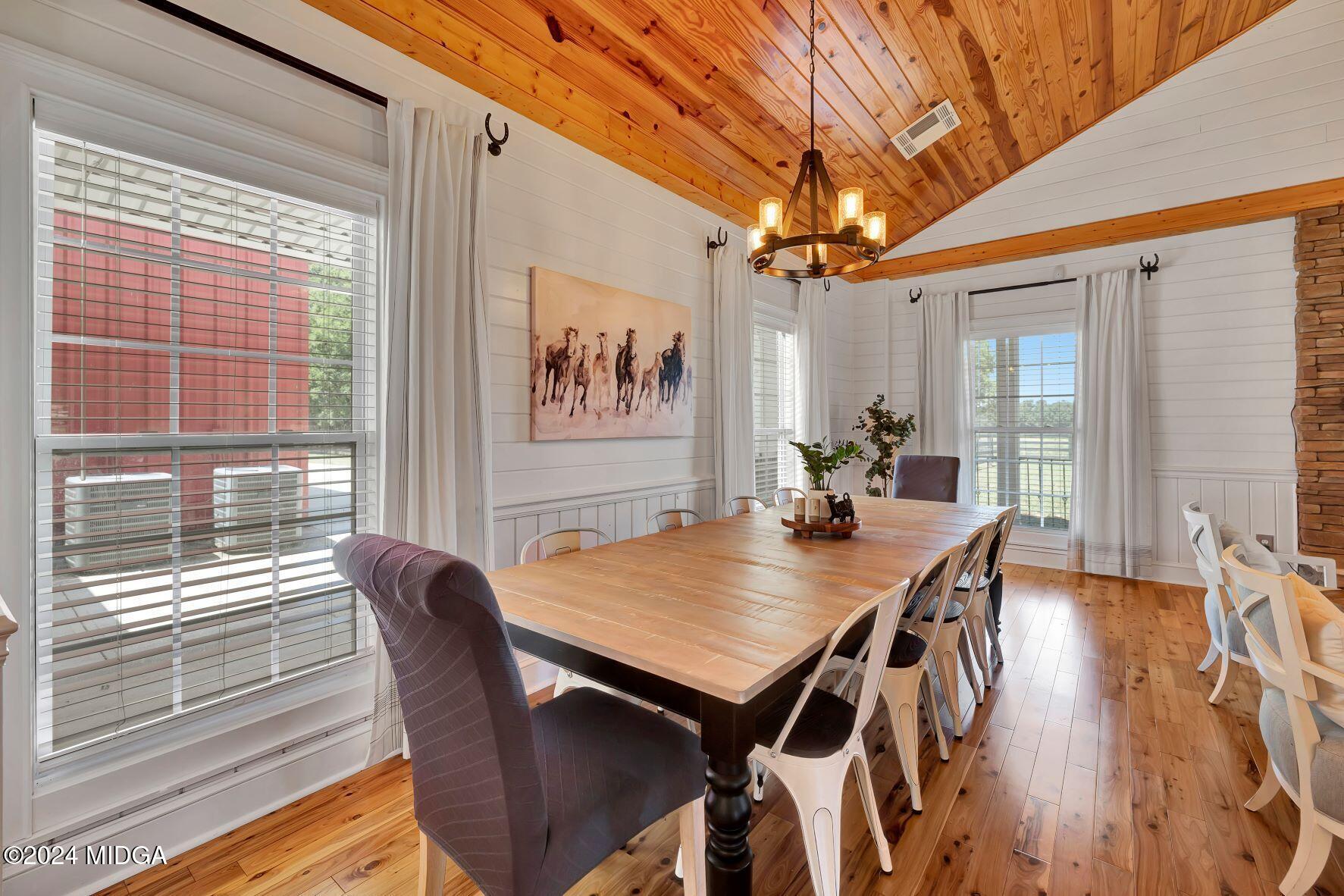 475 Brent Road Barnesville, GA 30204 - Photo 66 of 132 a view of a dining room with furniture wooden floor and chandelier