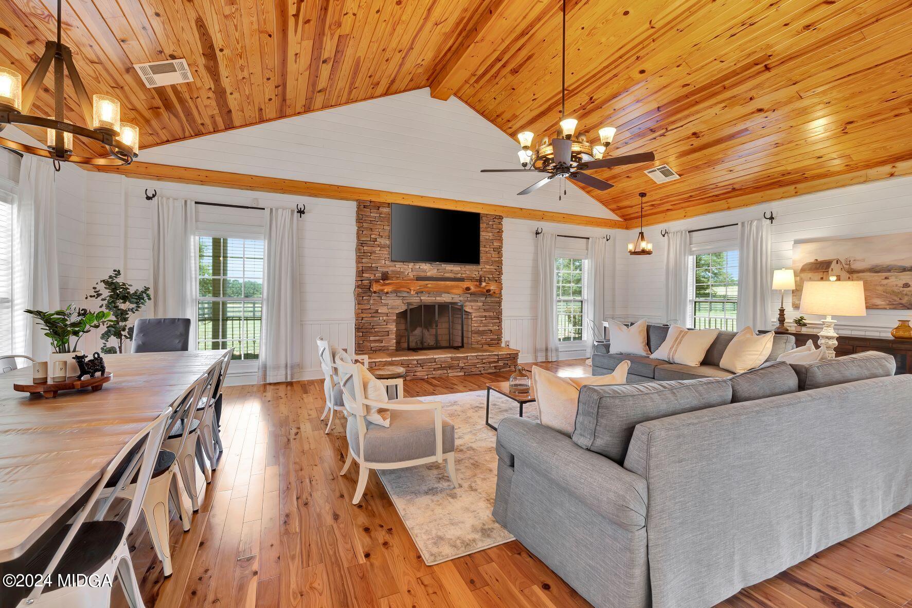 475 Brent Road Barnesville, GA 30204 - Photo 67 of 132 a living room with furniture a fireplace and a flat screen tv