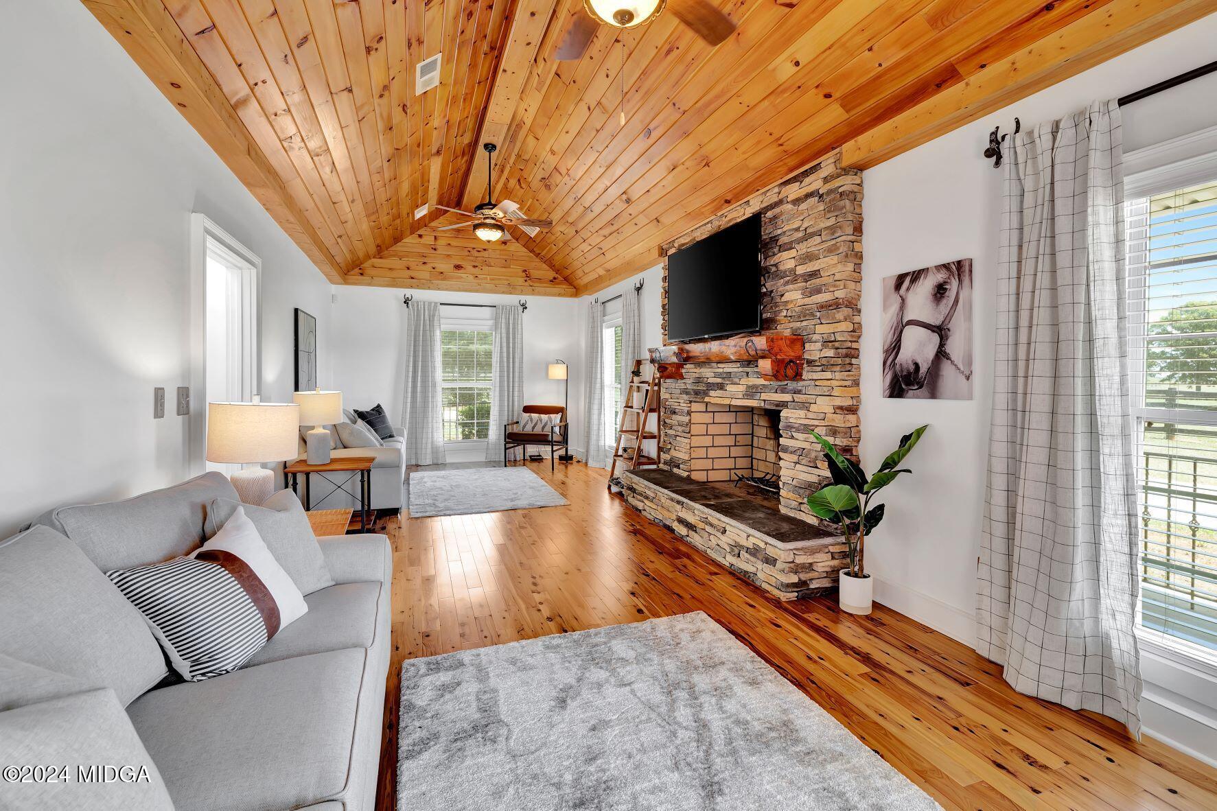 475 Brent Road Barnesville, GA 30204 - Photo 76 of 132 a living room with furniture and a flat screen tv