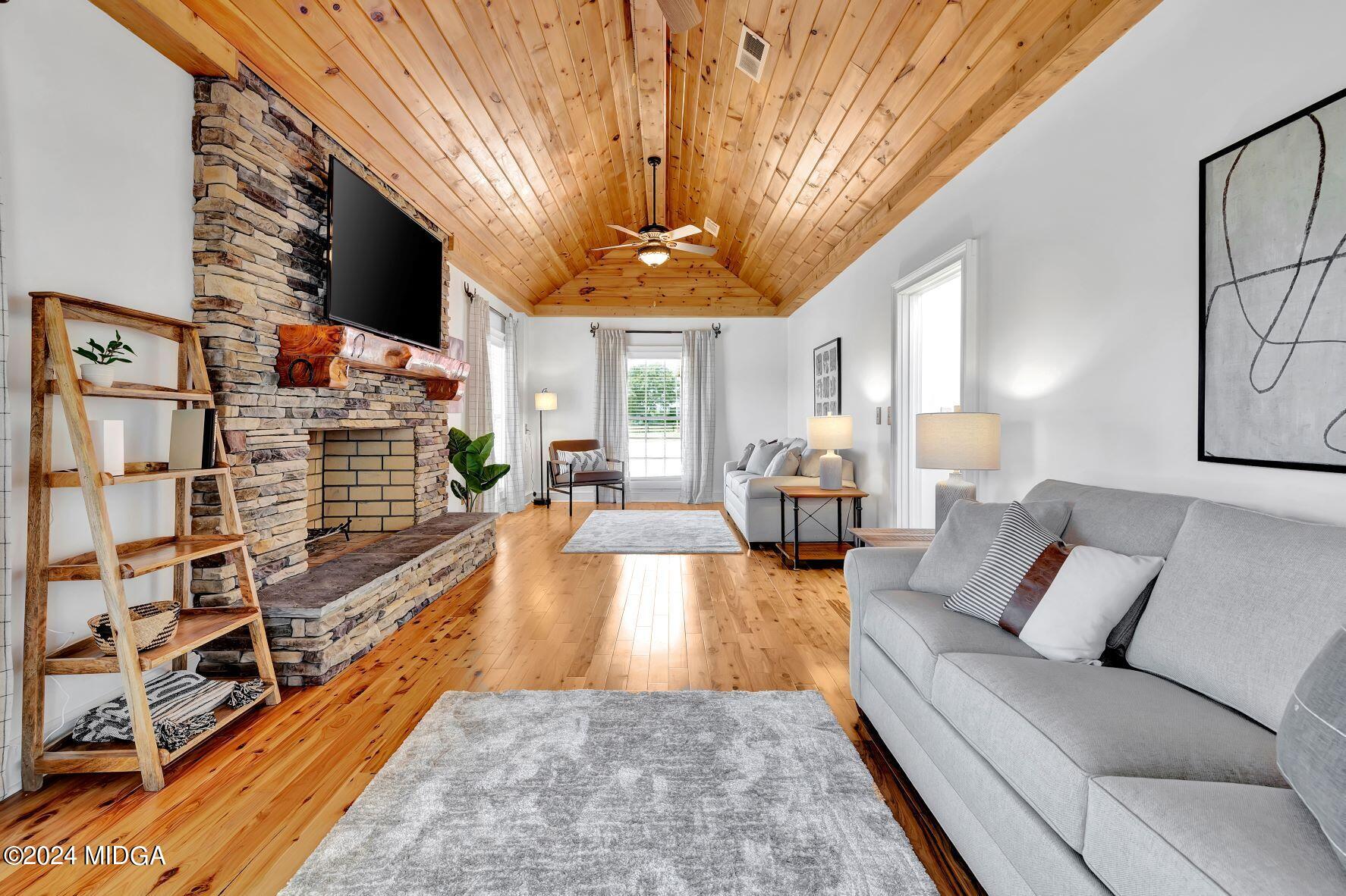 475 Brent Road Barnesville, GA 30204 - Photo 78 of 132 a living room with furniture flat screen tv and a fireplace