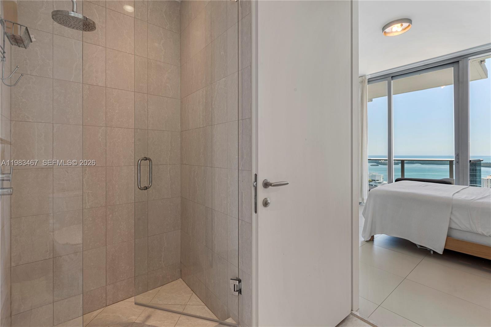 200 Biscayne Blvd Way, Unit 4907 Miami, FL 33131 - Photo 18 of 18 a room with a bed and a window