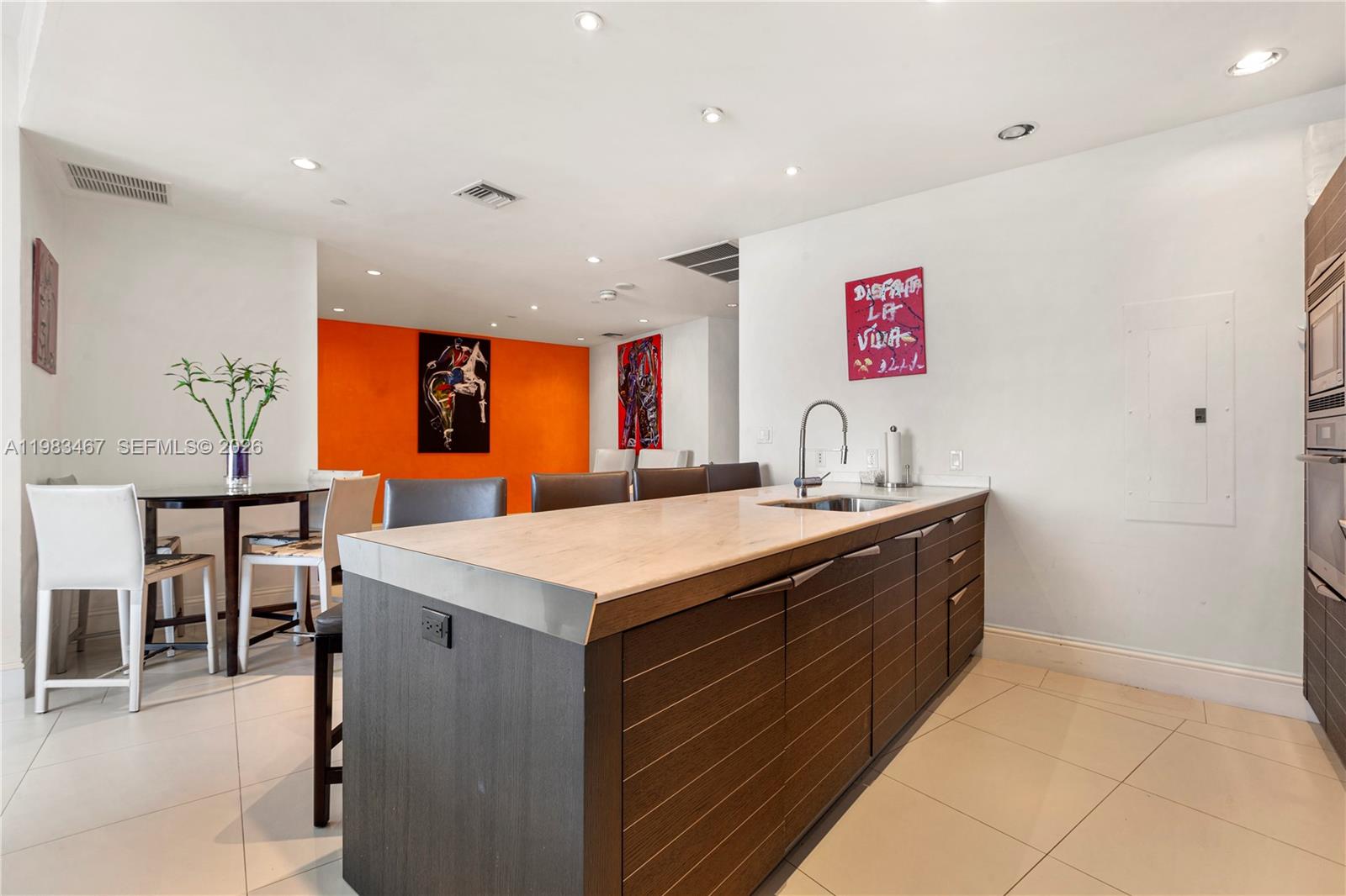 200 Biscayne Blvd Way, Unit 4907 Miami, FL 33131 - Photo 4 of 18 a kitchen with stainless steel appliances granite countertop a sink and a stove