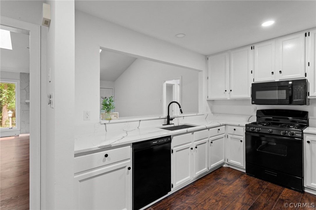 14307 Spring Gate Road Midlothian, VA 23112 - Photo 15 of 39 a kitchen with white cabinets and appliances