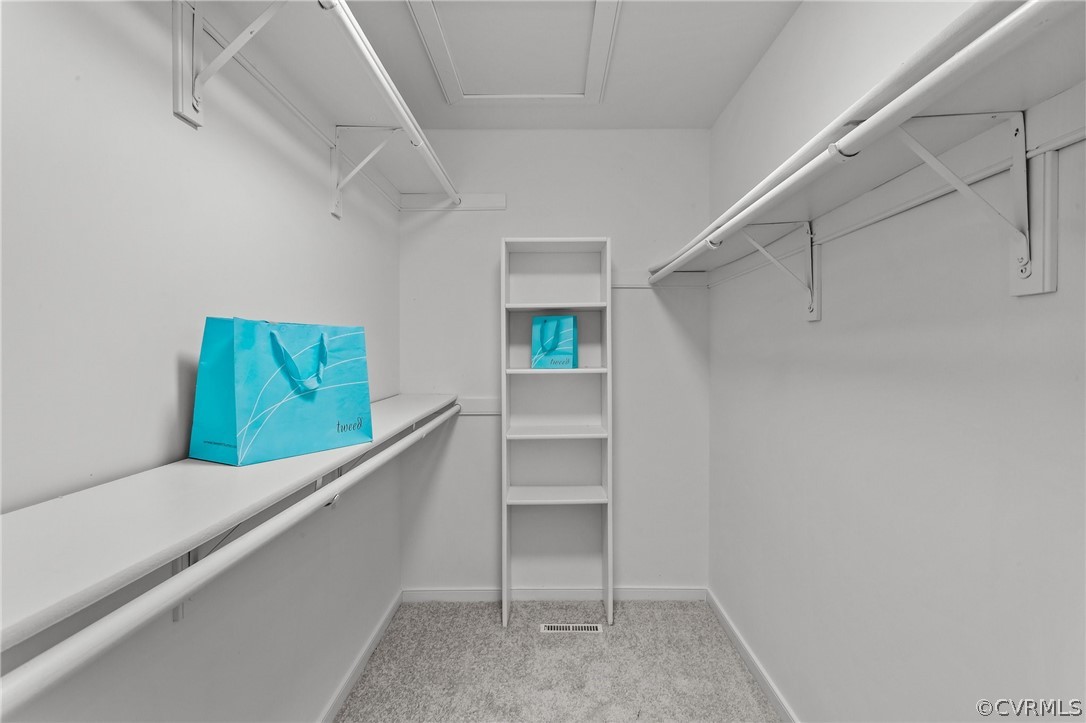 14307 Spring Gate Road Midlothian, VA 23112 - Photo 24 of 39 a hallway with cabinets and wooden floor