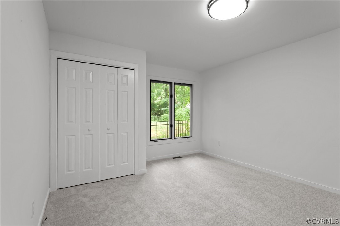 14307 Spring Gate Road Midlothian, VA 23112 - Photo 26 of 39 an empty room with windows