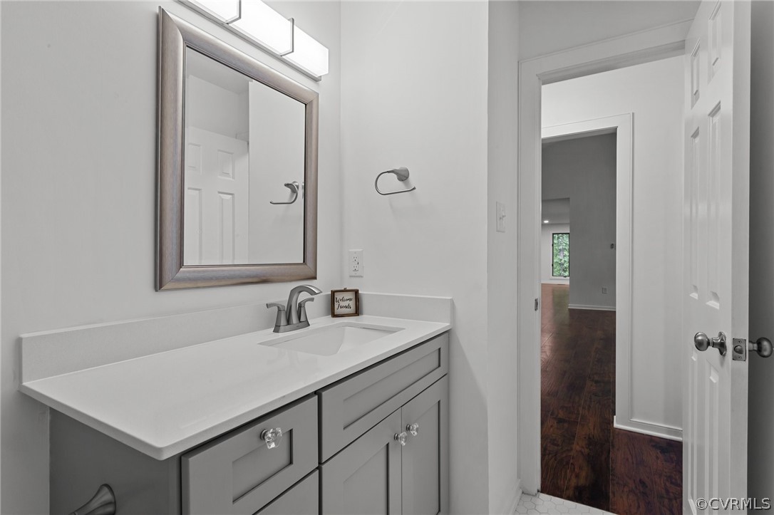 14307 Spring Gate Road Midlothian, VA 23112 - Photo 29 of 39 a bathroom with a sink a vanity and a mirror