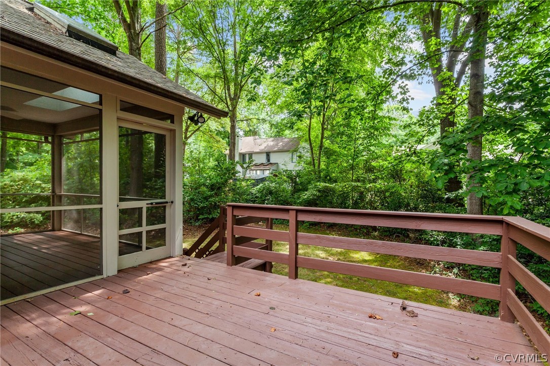 14307 Spring Gate Road Midlothian, VA 23112 - Photo 35 of 39 a view of deck with a large window and wooden floor