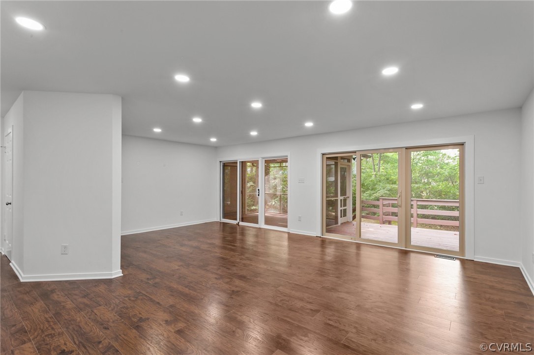 14307 Spring Gate Road Midlothian, VA 23112 - Photo 7 of 39 a view of an empty room with wooden floor and a window