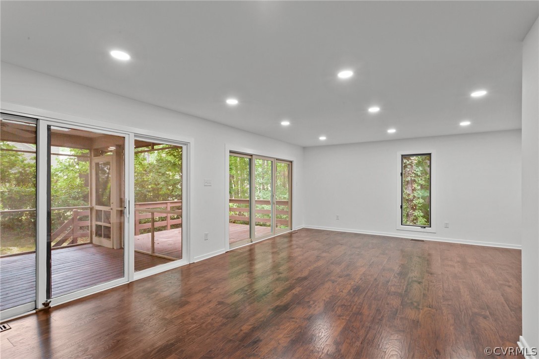 14307 Spring Gate Road Midlothian, VA 23112 - Photo 8 of 39 an empty room with wooden floor and windows
