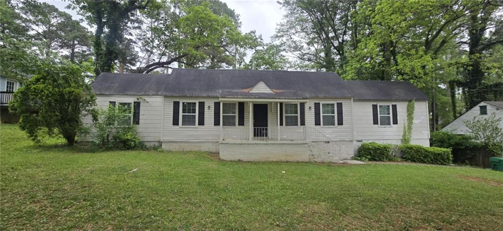 1516 Carter Road Decatur, GA 30032 - Photo 1 of 1 a front view of a house with a garden