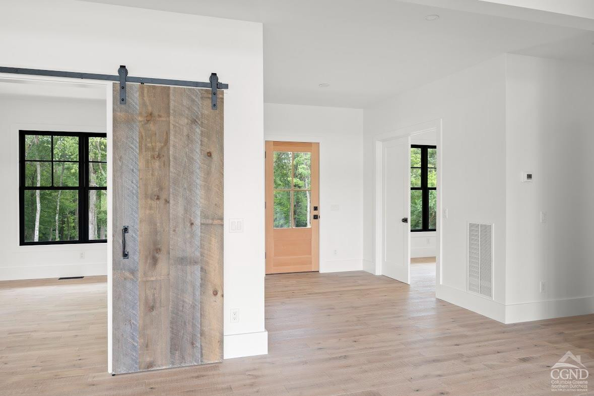 49 Snyder Pond Road Copake, NY 12516 - Photo 13 of 25 a view of entryway with wooden floor and window