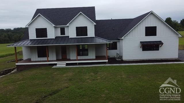 49 Snyder Pond Road Copake, NY 12516 - Photo 2 of 25 a front view of a house with a yard