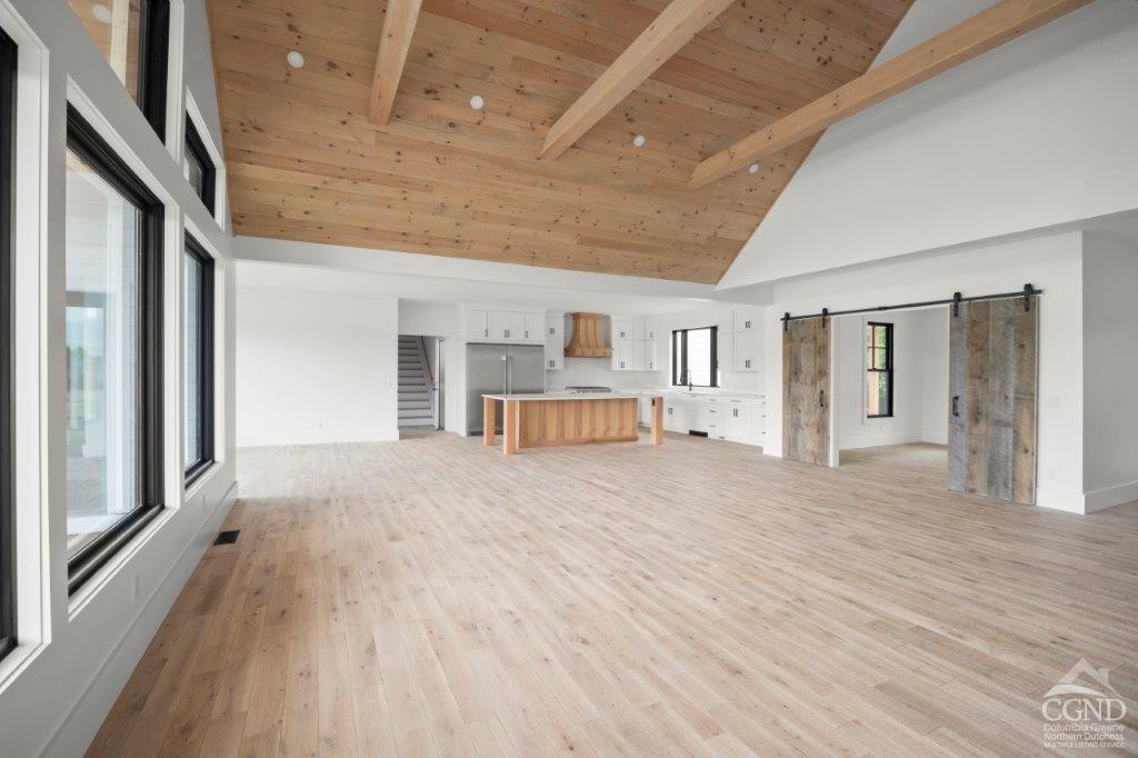 49 Snyder Pond Road Copake, NY 12516 - Photo 23 of 25 a room with natural light and hardwood floor