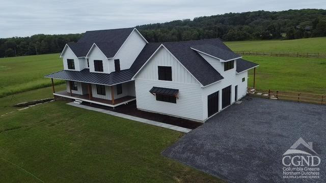 49 Snyder Pond Road Copake, NY 12516 - Photo 3 of 25 a house view with a garden space