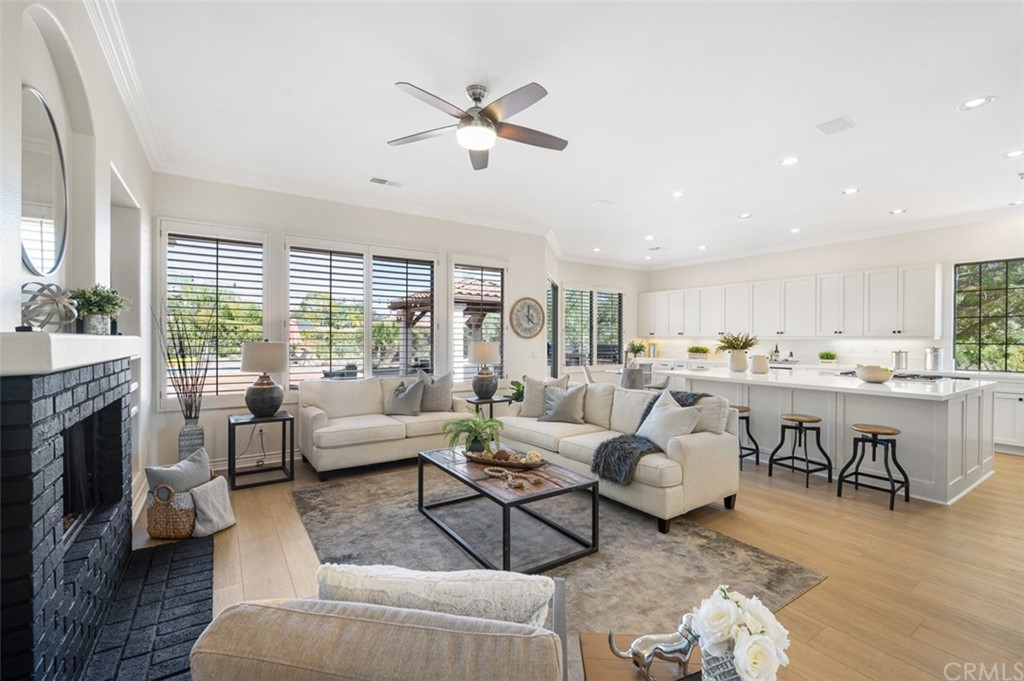 3724 Cedar Vale Way Fallbrook, CA 92028 - Photo 1 of 39 a living room with furniture fireplace and a large window