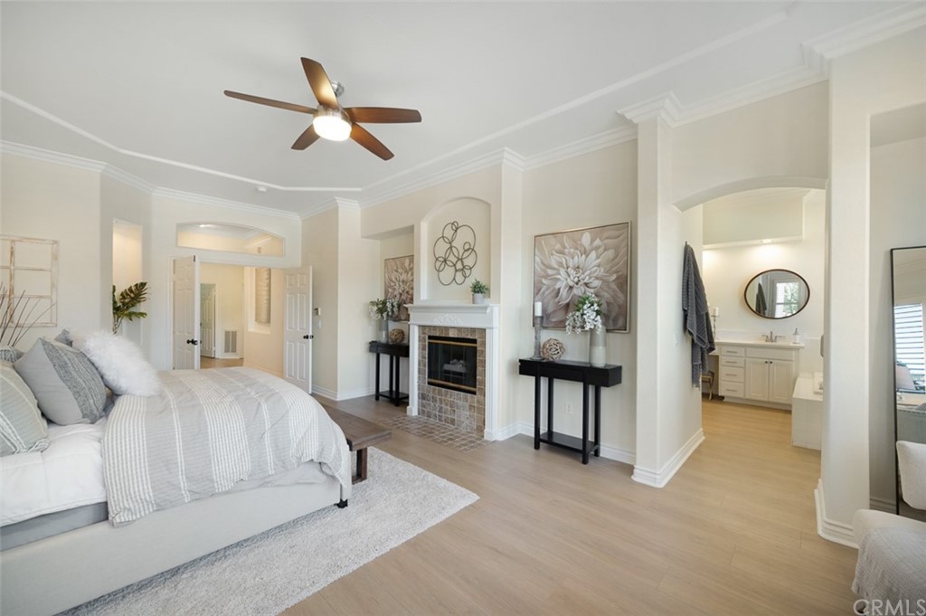 3724 Cedar Vale Way Fallbrook, CA 92028 - Photo 12 of 39 a bedroom with a bed and a chandelier