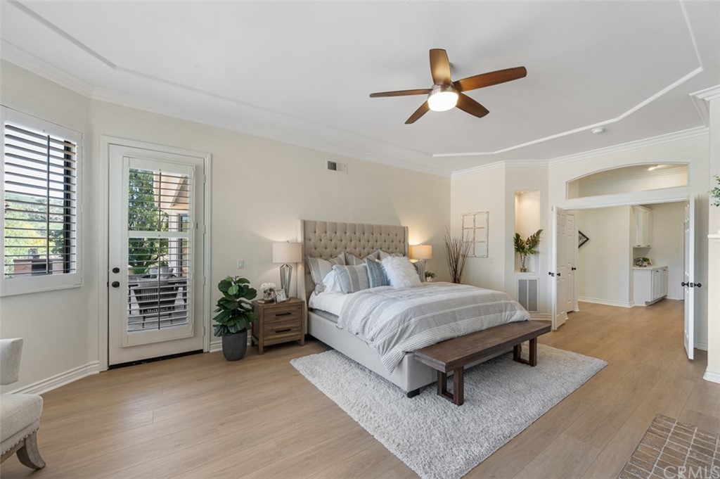 3724 Cedar Vale Way Fallbrook, CA 92028 - Photo 13 of 39 a spacious bedroom with a bed and a chandelier
