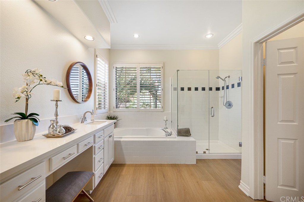3724 Cedar Vale Way Fallbrook, CA 92028 - Photo 15 of 39 a spacious bathroom with a tub double sink and a mirror