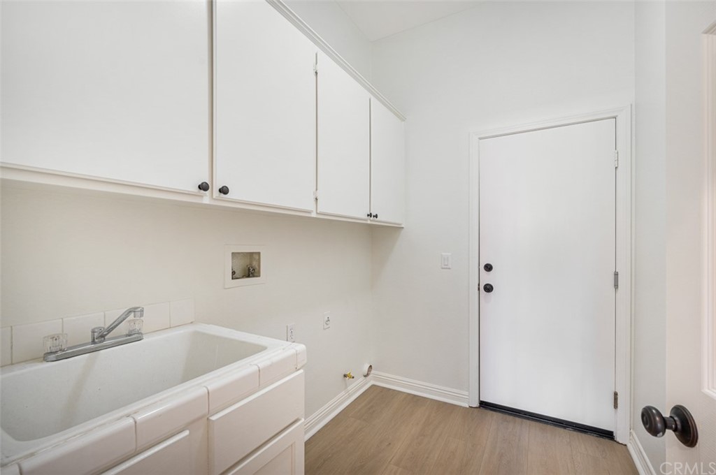 3724 Cedar Vale Way Fallbrook, CA 92028 - Photo 19 of 39 a bath room with a sink and cabinets