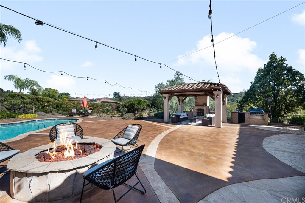 3724 Cedar Vale Way Fallbrook, CA 92028 - Photo 25 of 39 a view of a patio with a table chairs and a table