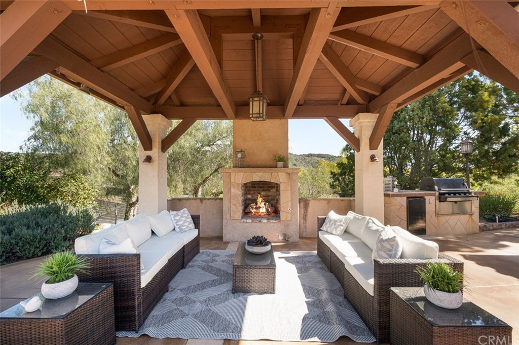 3724 Cedar Vale Way Fallbrook, CA 92028 - Photo 26 of 39 a outdoor space with patio fireplace couches and a fireplace