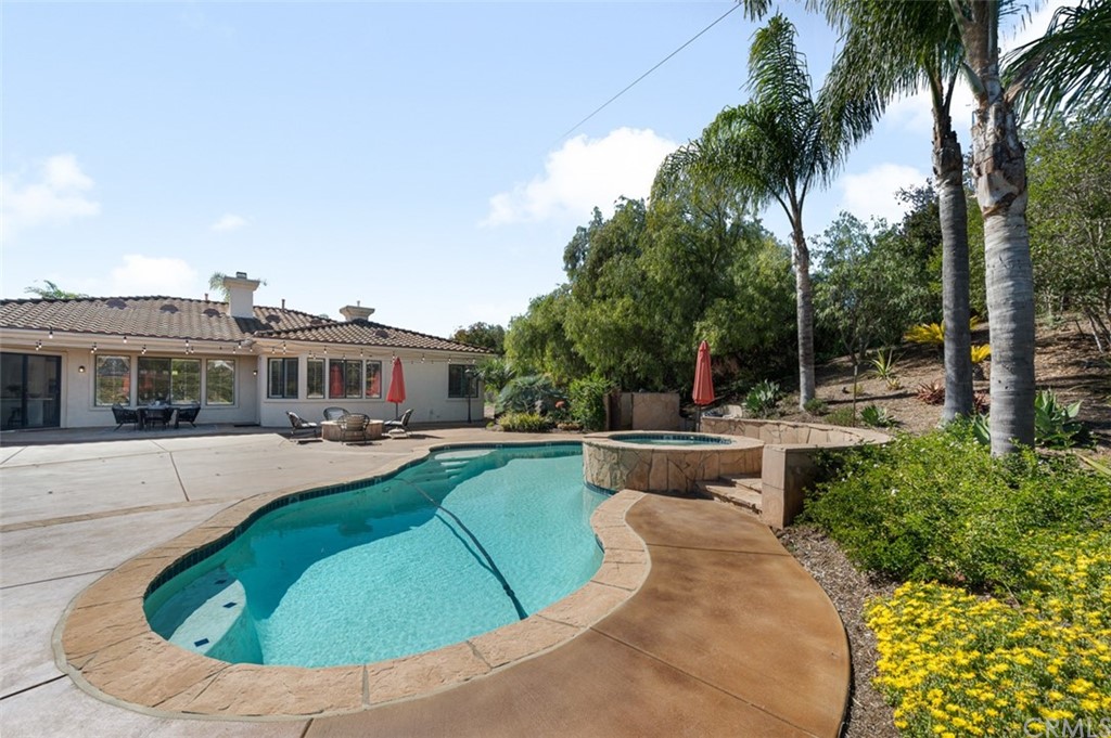3724 Cedar Vale Way Fallbrook, CA 92028 - Photo 27 of 39 a view of a house with swimming pool and sitting area