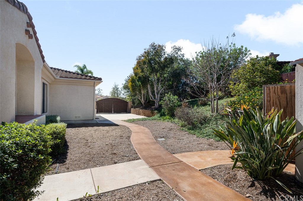3724 Cedar Vale Way Fallbrook, CA 92028 - Photo 29 of 39 a front view of a house with a yard and trees