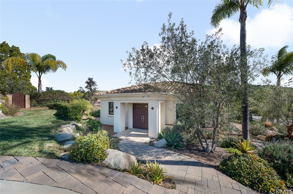 3724 Cedar Vale Way Fallbrook, CA 92028 - Photo 30 of 39 a front view of a house with a garden