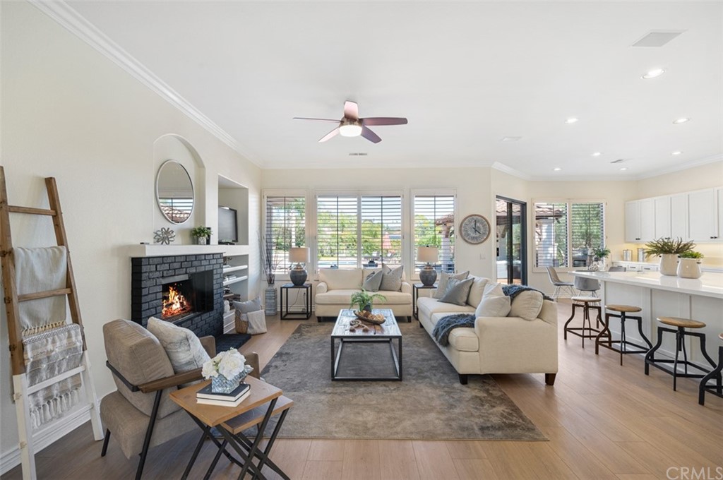 3724 Cedar Vale Way Fallbrook, CA 92028 - Photo 3 of 39 a living room with furniture fireplace and a table