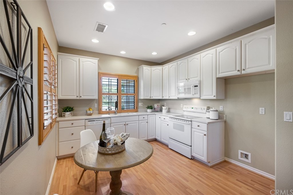 3724 Cedar Vale Way Fallbrook, CA 92028 - Photo 31 of 39 a kitchen with cabinets a sink and appliances in it