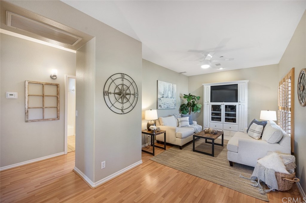3724 Cedar Vale Way Fallbrook, CA 92028 - Photo 32 of 39 a living room with furniture a window and a fireplace
