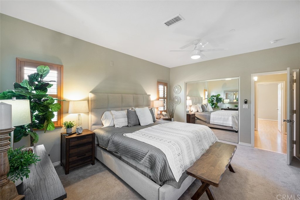 3724 Cedar Vale Way Fallbrook, CA 92028 - Photo 34 of 39 a bedroom with a bed and a potted plant